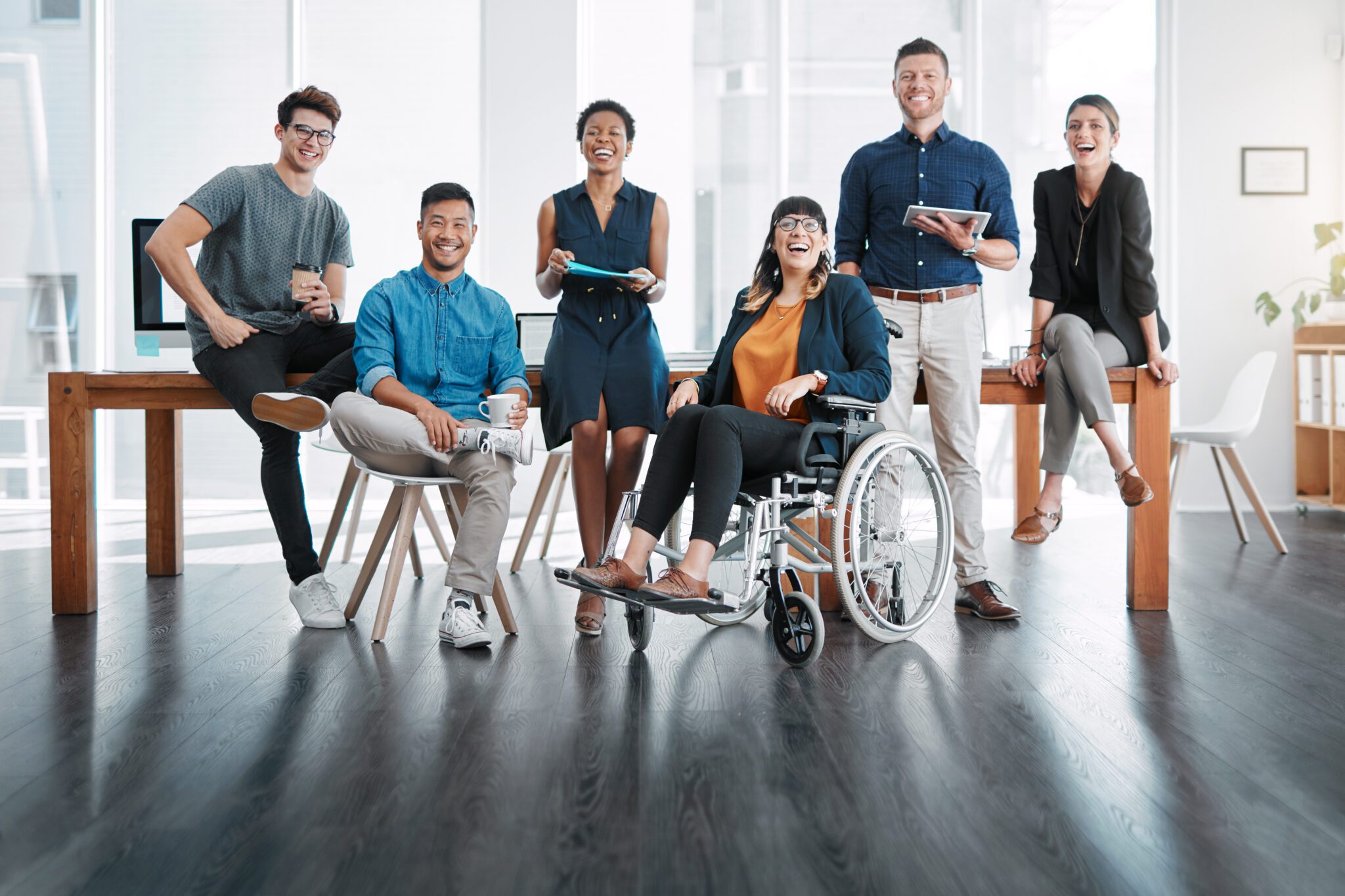 A group of confident business people working together in a modern office