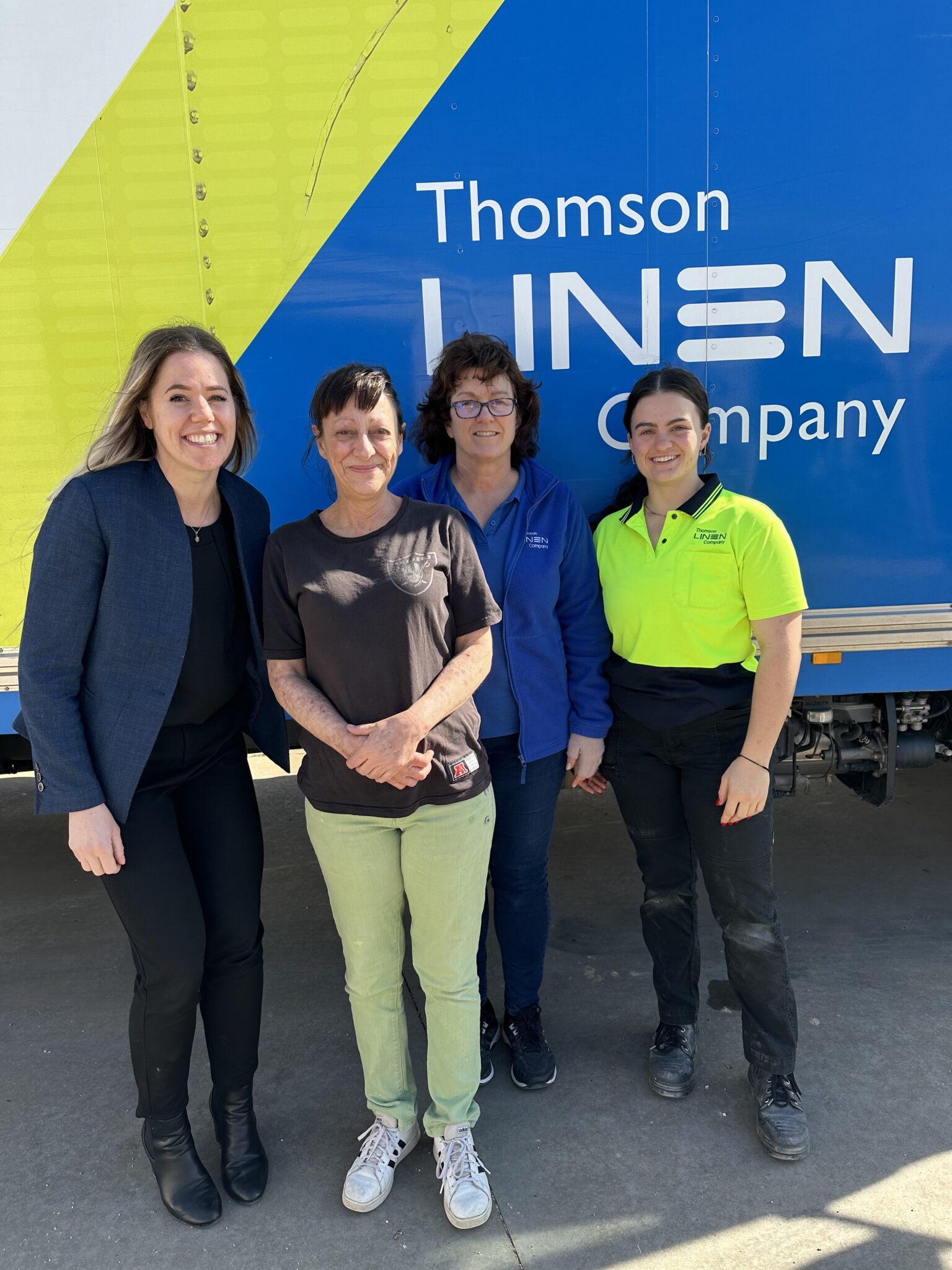 Karen is all smiles at her new job. L-R: CVGT Employment Skills Mentor Danella, Workforce Australia participant Karen, Thomson Linen Company Owner Lesley and her daughter Sophie. 