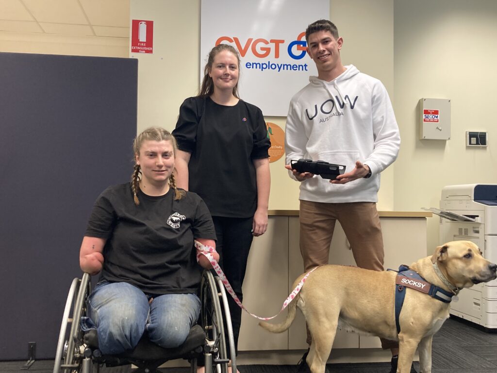 Grace with her dog Socksy, Tegan CVGT Employment Consultant and Charles from University of Wollongong. 