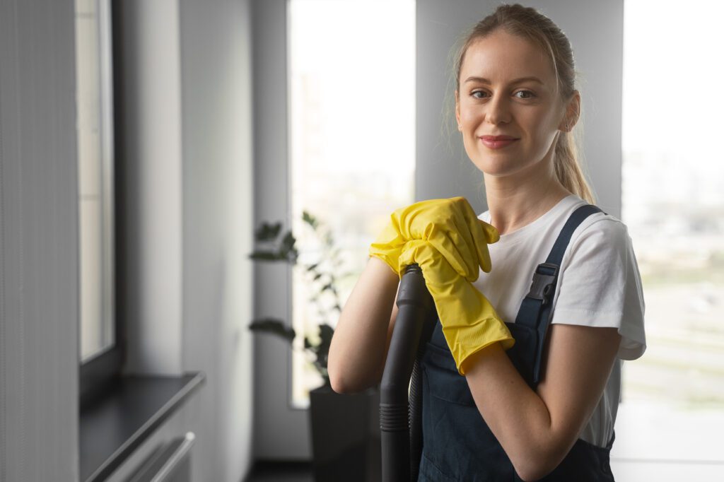 medium shot woman cleaning indoors
