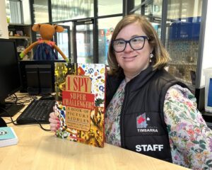 Brooke who has Down Syndrome, smiling at her inclusive job at the primary school