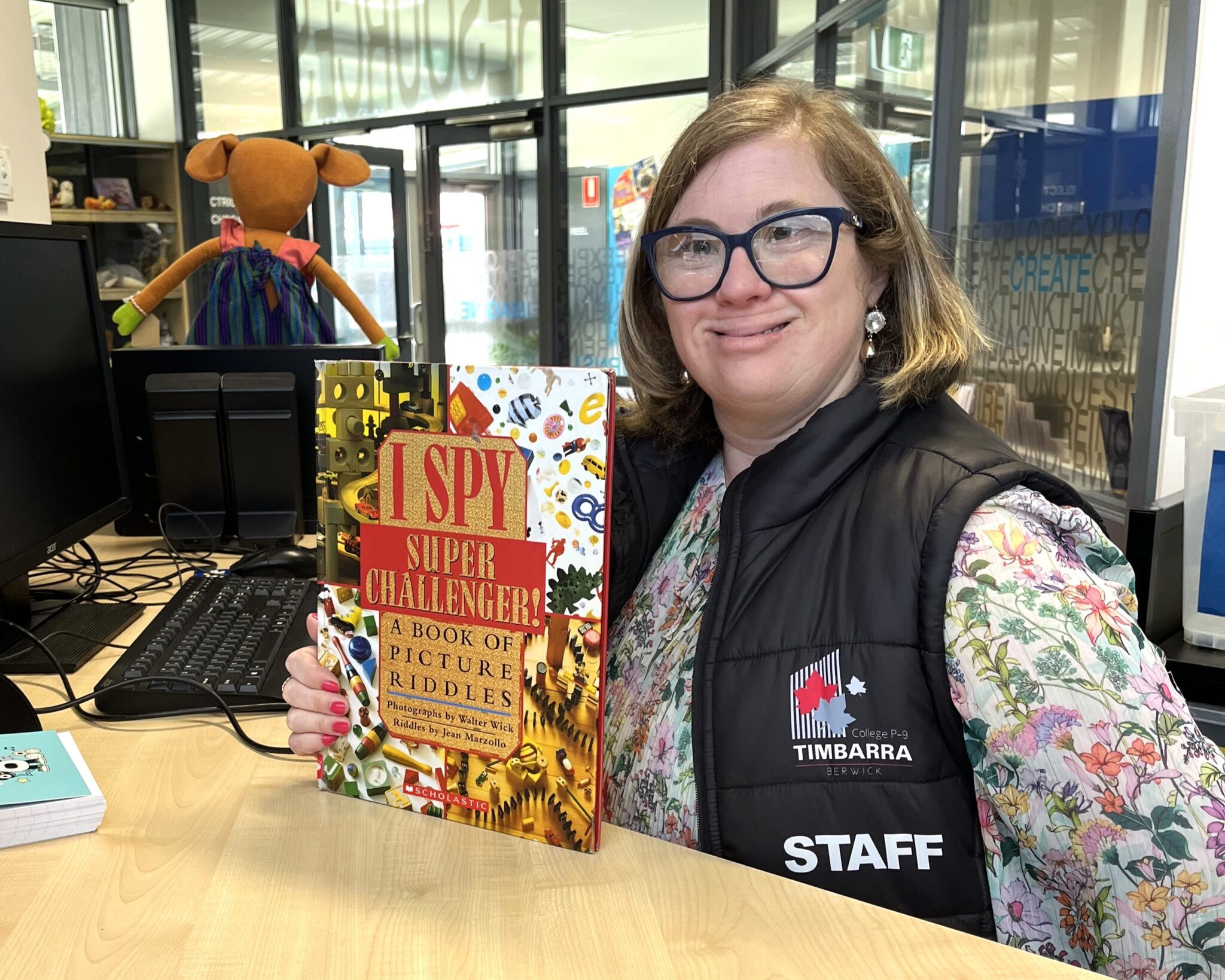 Brooke who has Down Syndrome, smiling at her inclusive job at the primary school