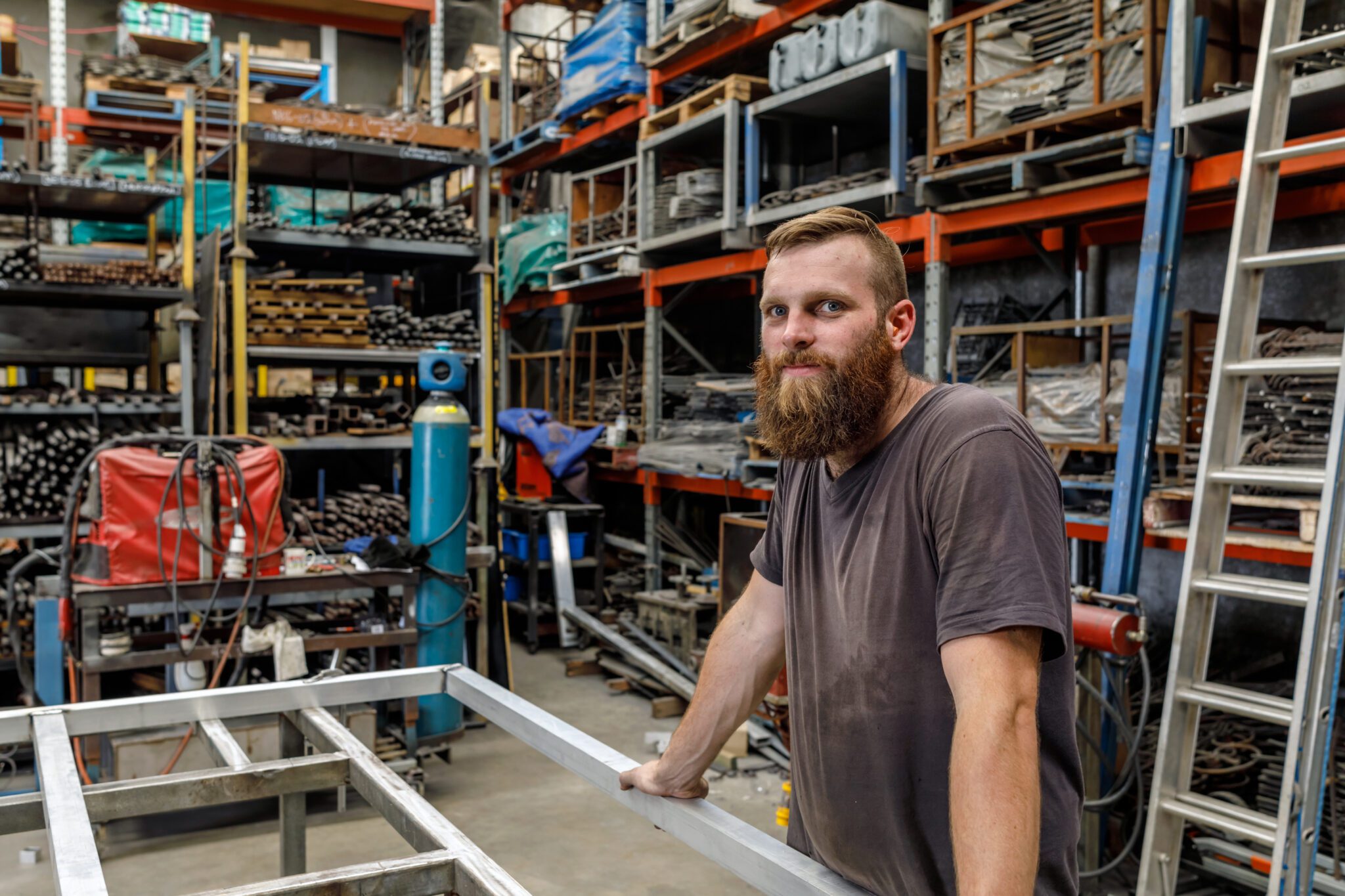 Young Australian Apprentice Metal Worker In Factory