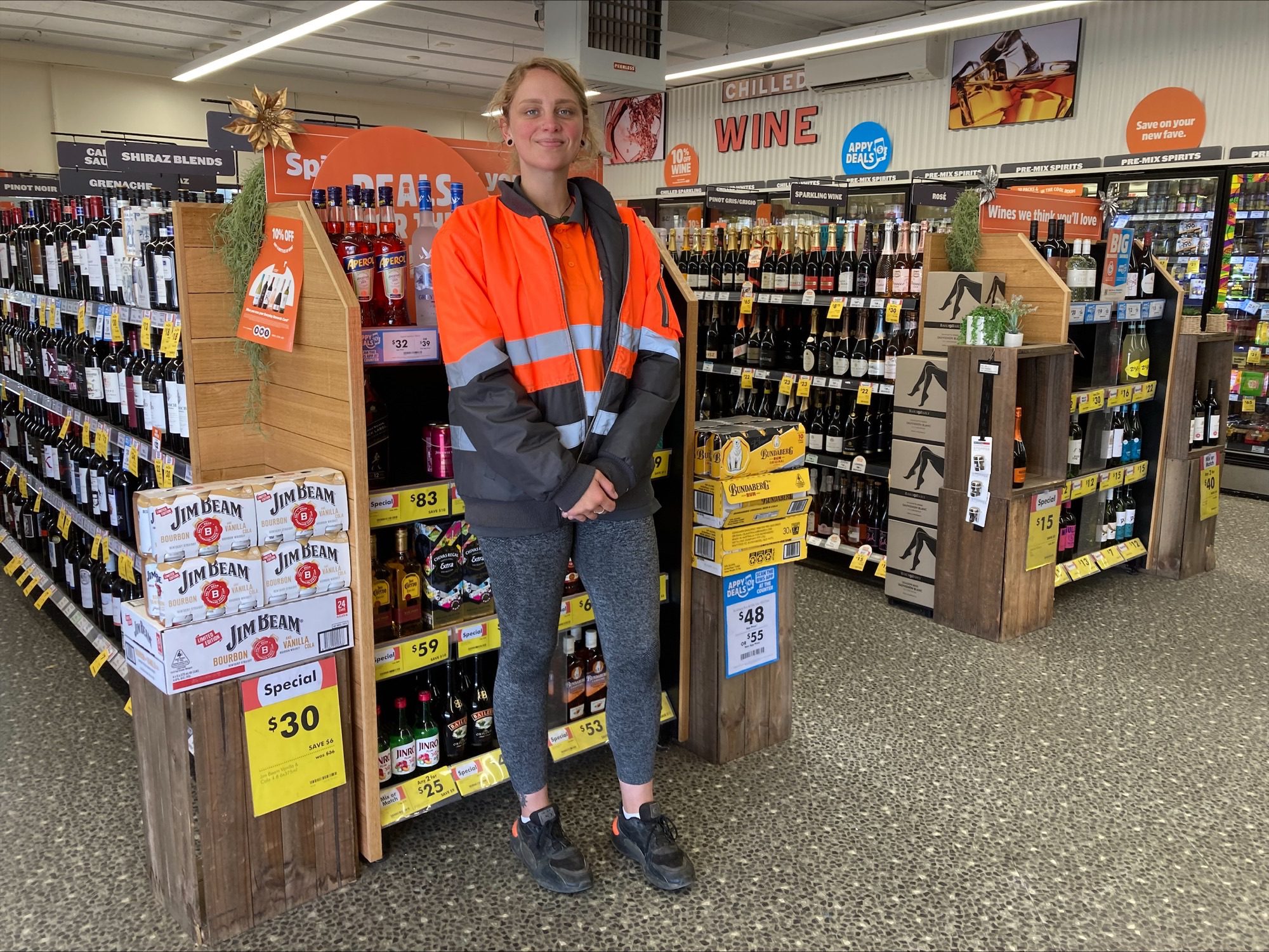 young women working in liquor supermarket store
