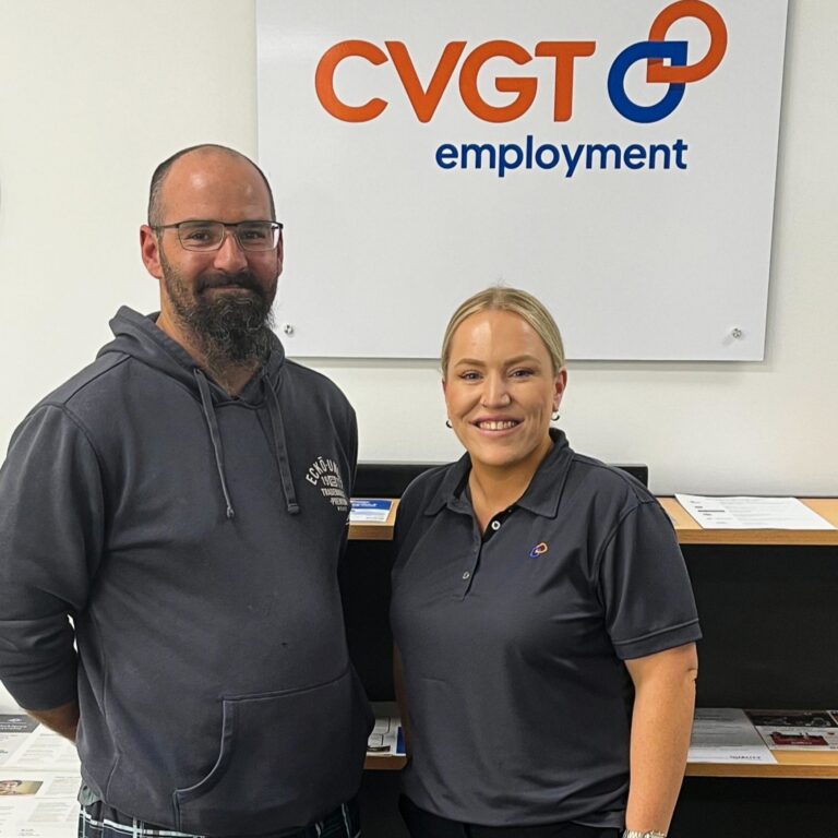 Two people in an office setting.