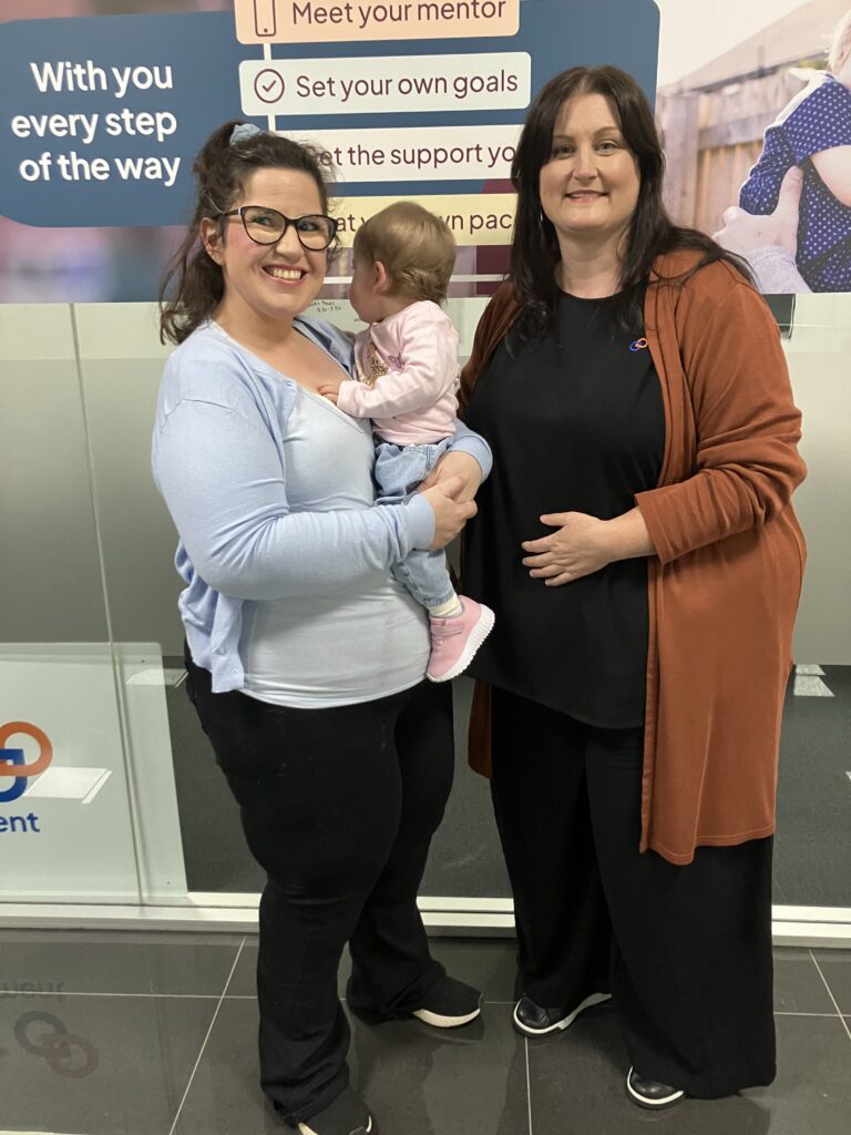 Mother in office with mentor support worker