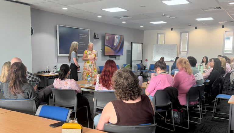 Kristy Glew, Talent Acquisition Leader at Each, presenting to the Each team